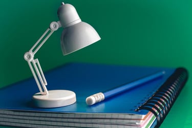 A desk lamp looking at a pencil